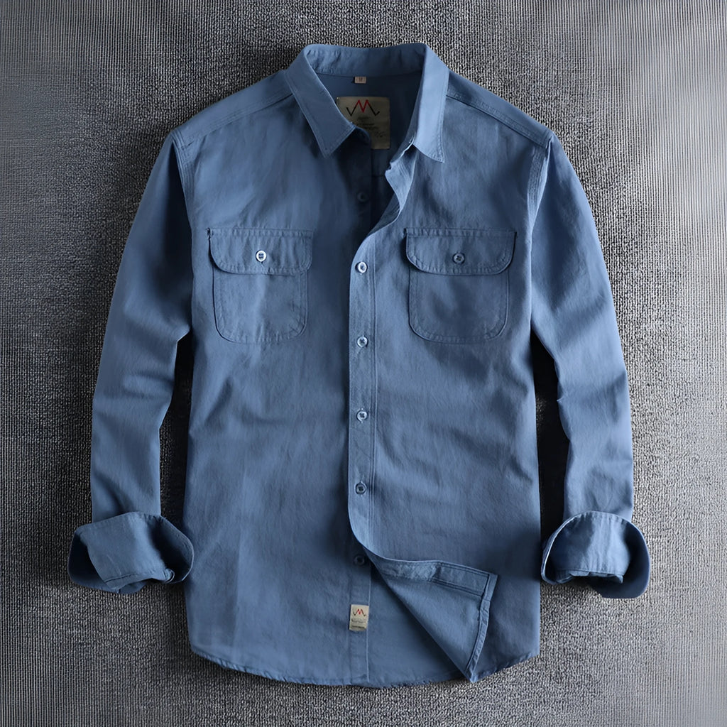 Men's solid colour cotton shirt with cardigan style collar in light blue, showing long sleeves and regular fit