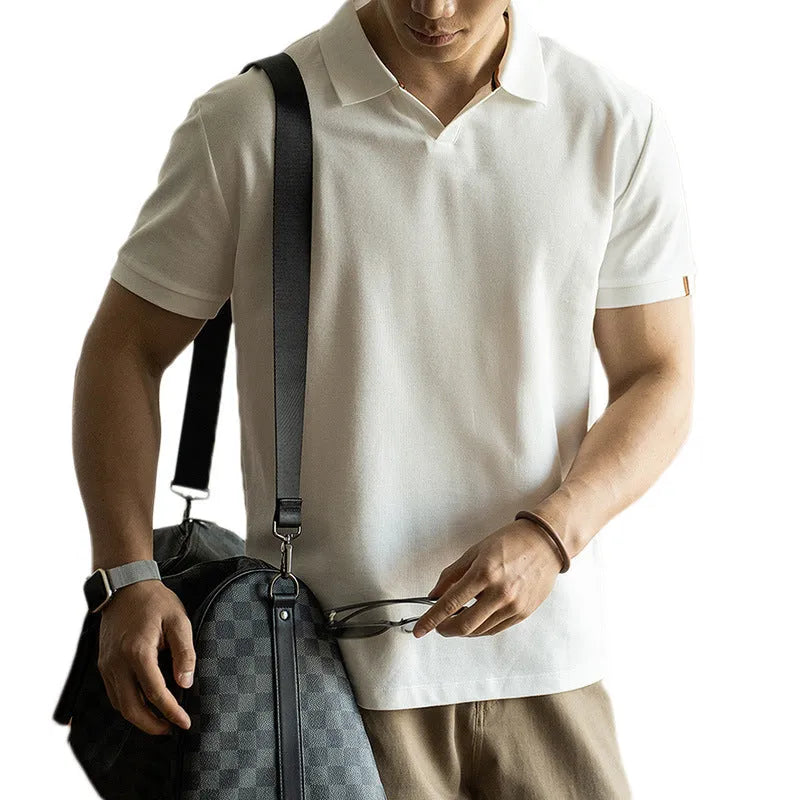 American-style short-sleeved polo shirt in a cotton-polyester blend, shown in blue, black, or white.