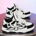 Men's white thick bottom chunky sneakers with lace-up front and round toe.