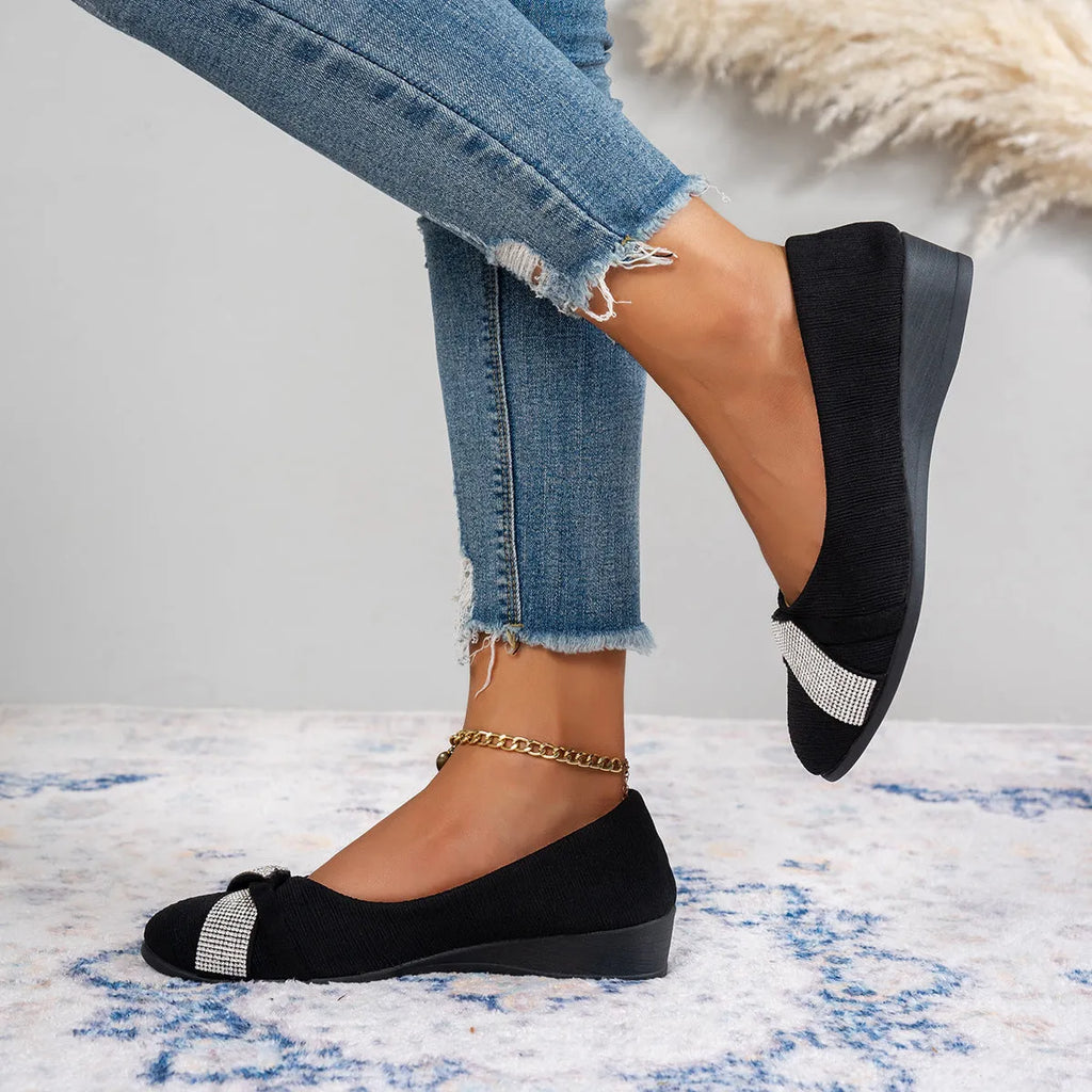 Women's black casual slip-on shoes with rhinestone details on fabric upper and chunky heel