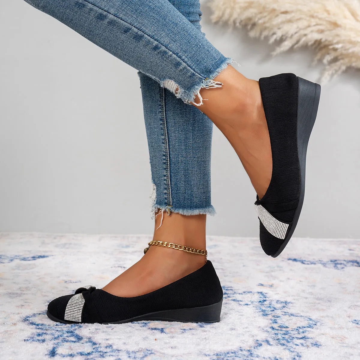 Women's black casual slip-on shoes with rhinestone details on fabric upper and chunky heel