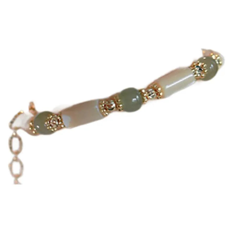 Natural white lip shell Hetian jade bracelet with round beads and geometric design