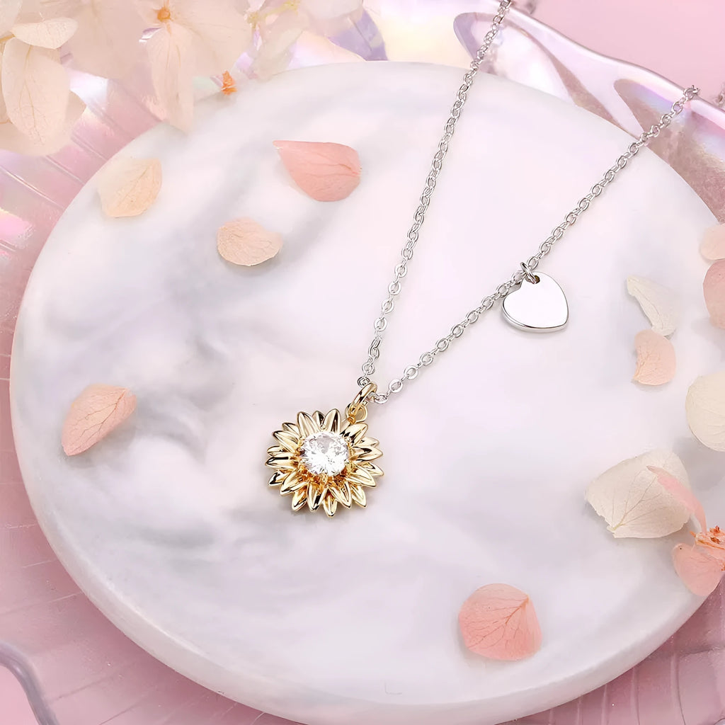 Women's sterling silver sunflower necklace with geometric pendant and adjustable cross chain.