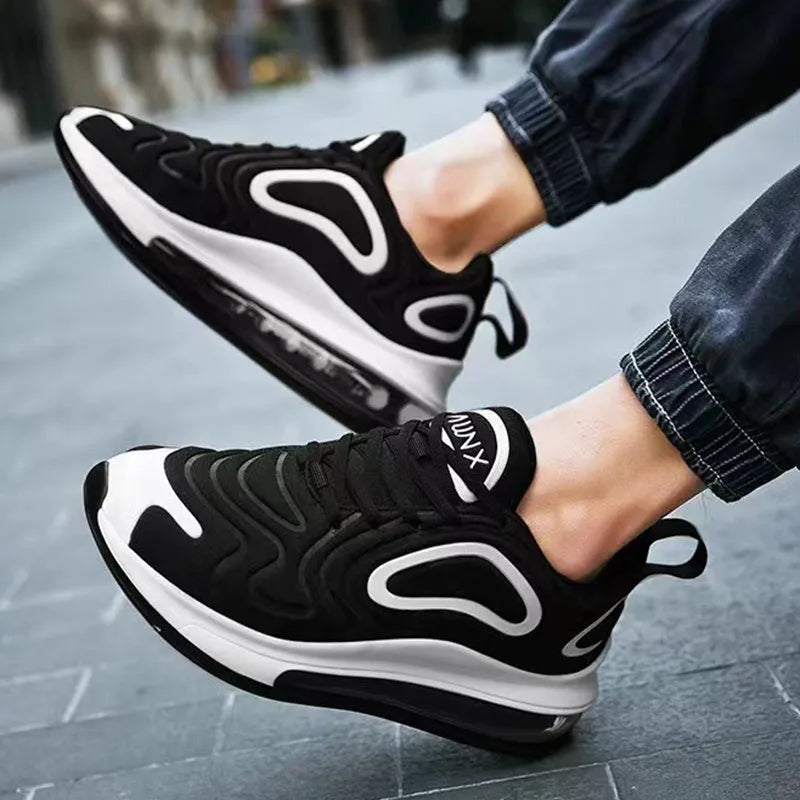 Men's black casual sneakers with artificial PU upper, thick plastic sole, and front lace-up design for outdoor sports.