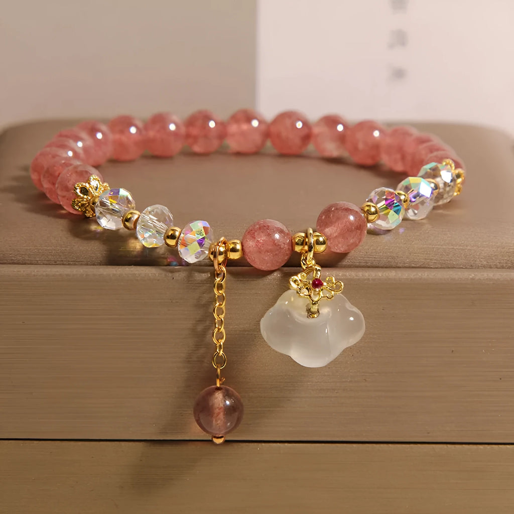 Women's crystal bracelet with strawberry quartz beads and white agate auspicious clouds design