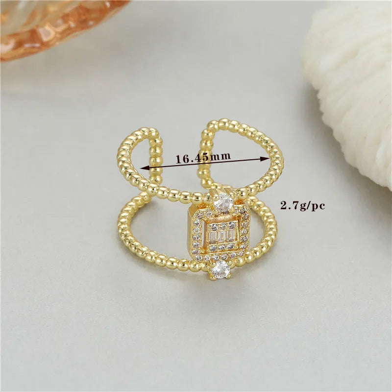 Copper open ring with 14K copper-plated gold finish and adjustable U-shaped asymmetric design
