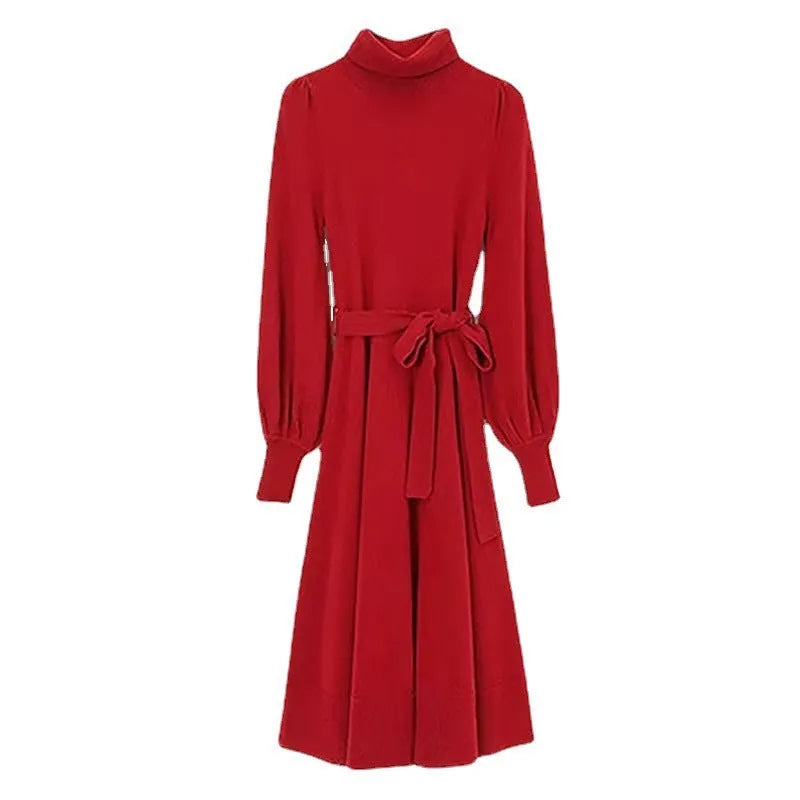 A rose red knitted turtleneck dress with long sleeves, an elastic waist, and a loose mid-length skirt.