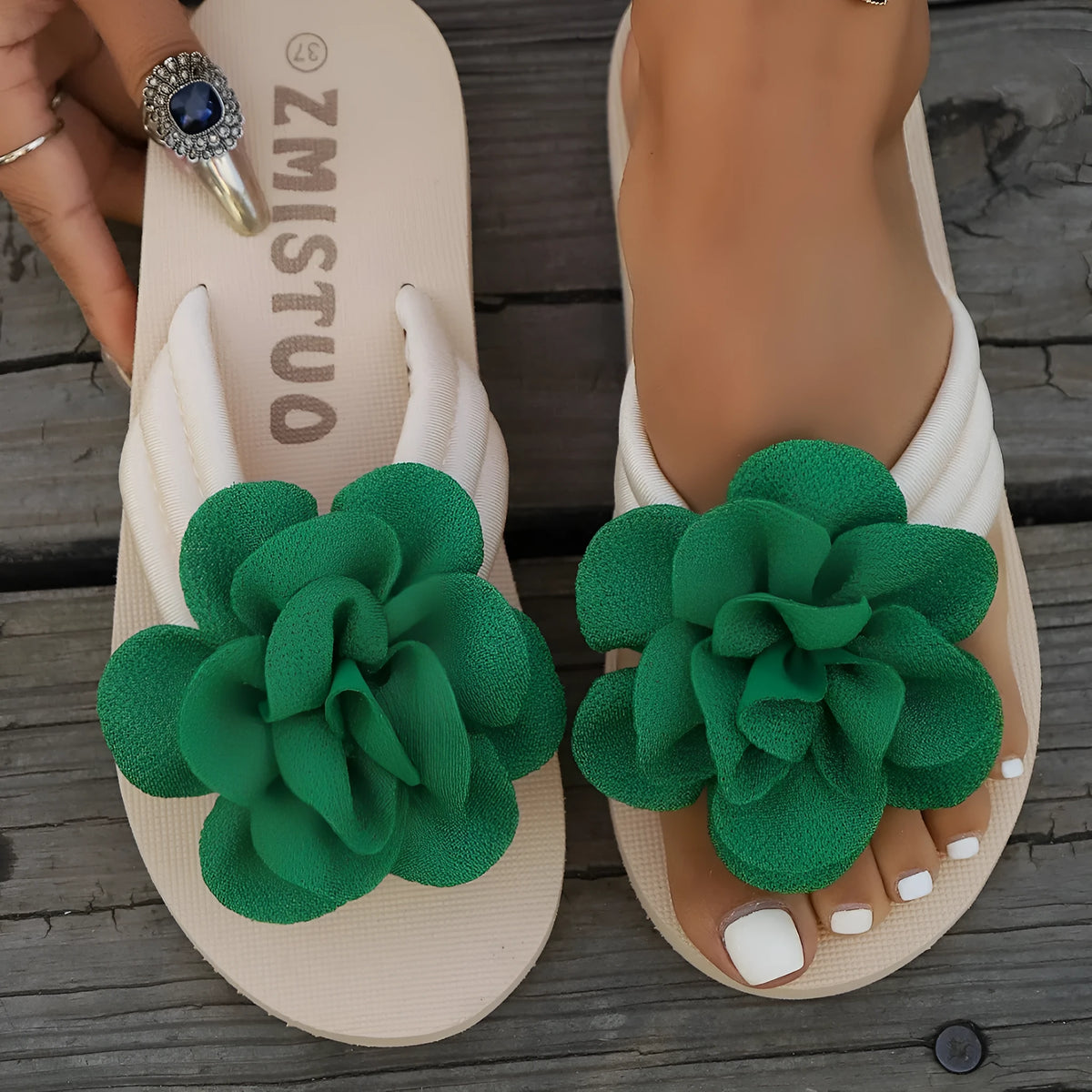 Plus size women's floral patterned PU flip flops in green, shown in a size 39.
