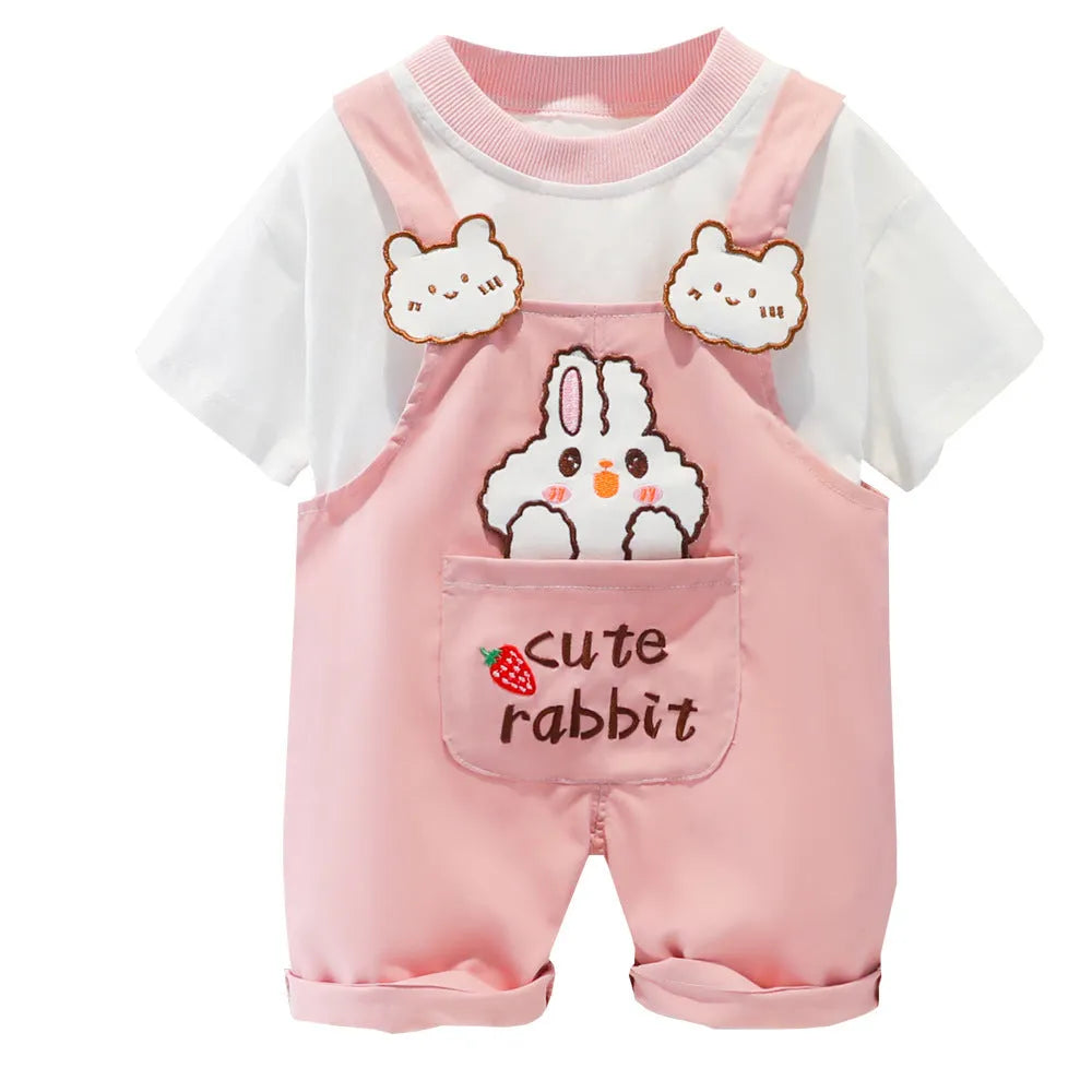 Baby wearing yellow cotton summer overalls with cartoon pattern and front buttons