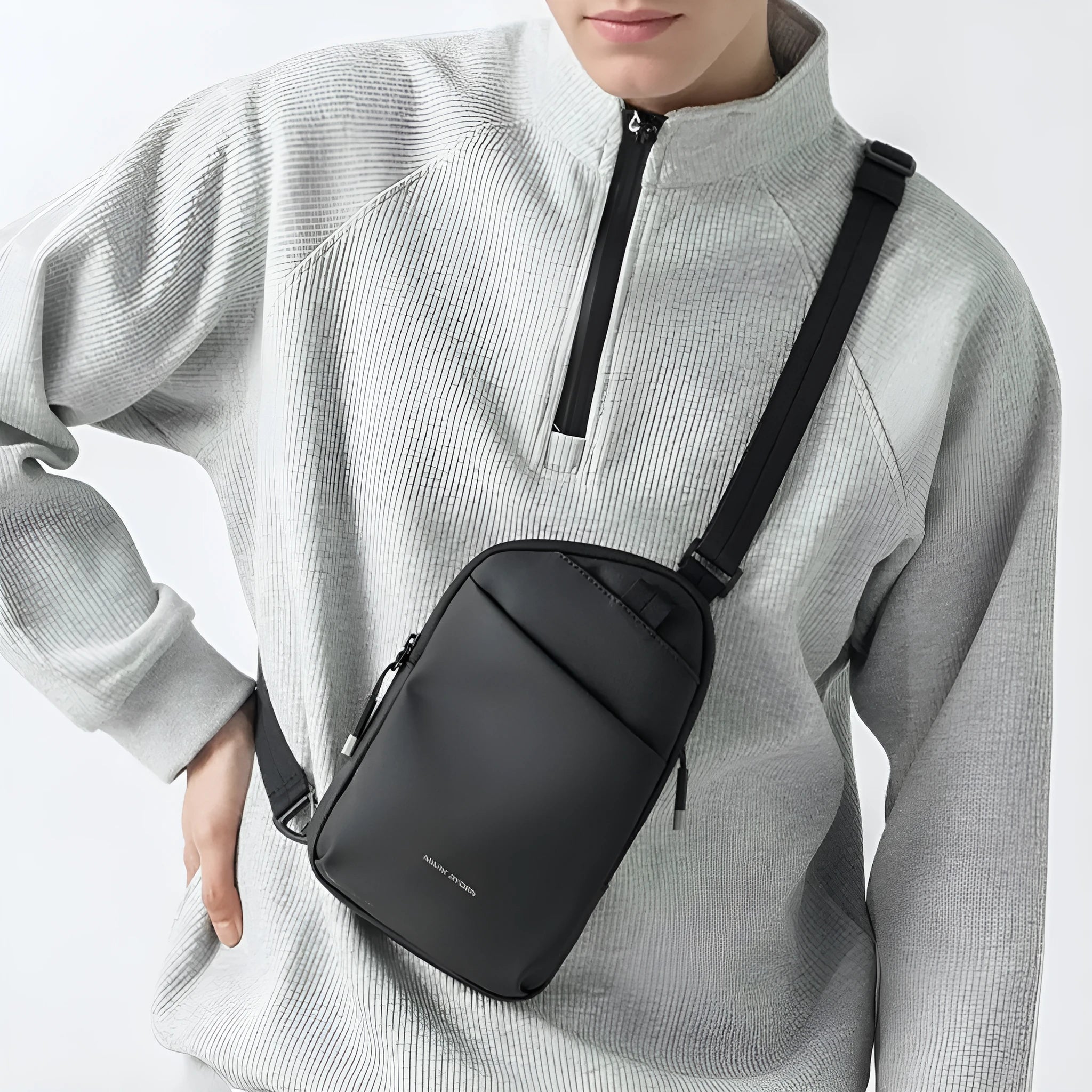 Men's lightweight black Oxford cloth crossbody bag with simple design and visible stitching.