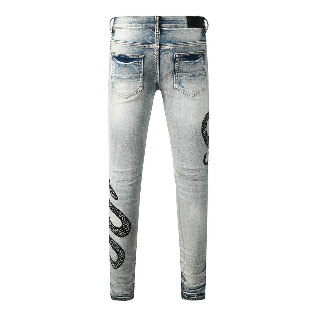 Man's blue distressed skinny jeans with a street fashion wash and button fly.