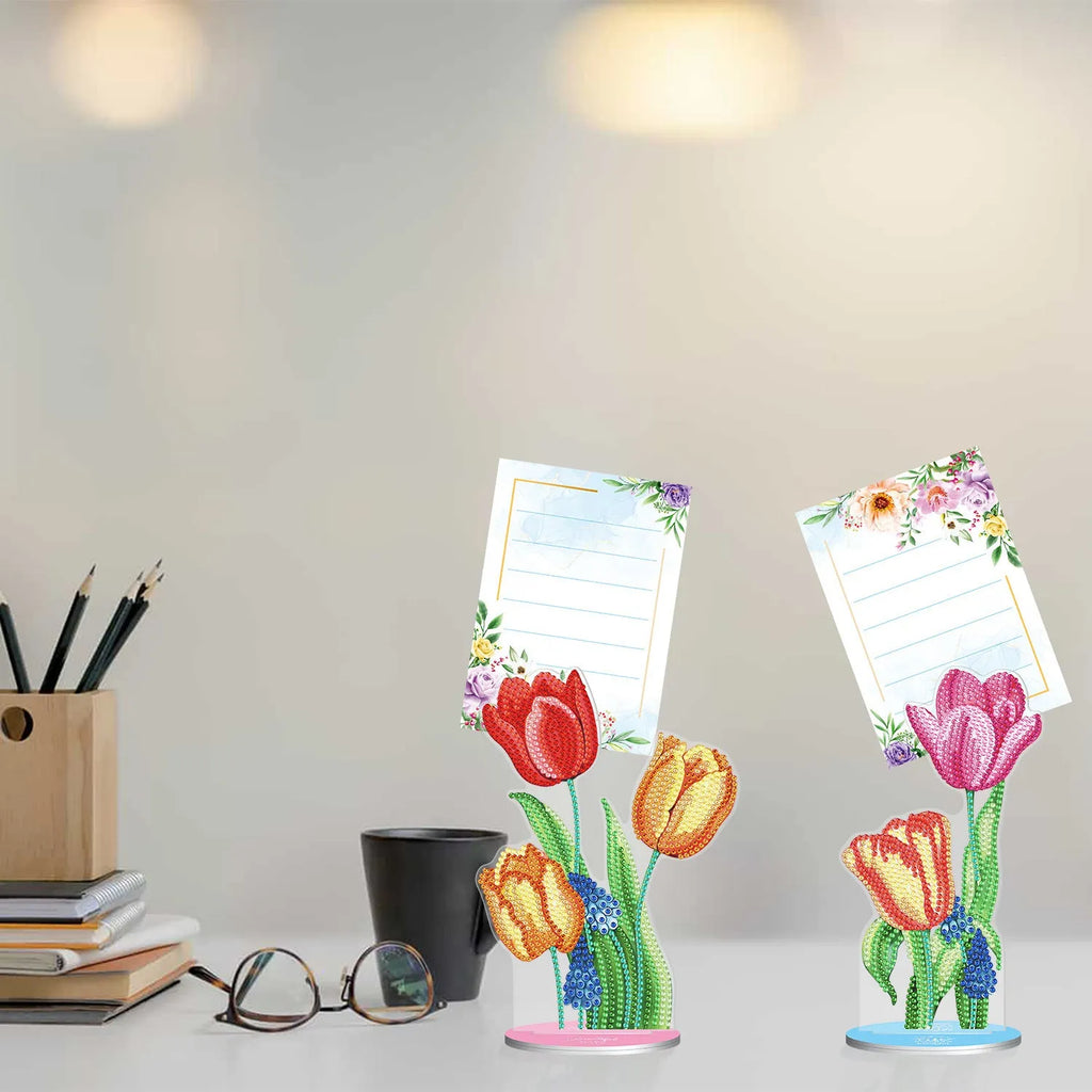 Diamond painting decorative note clip with frameless handmade American craft design on a desktop.