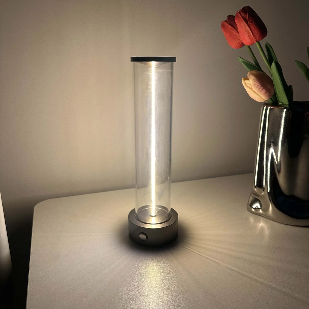 Modern glass LED light strip with magnetic back, measuring 234mm high, on a metal surface.
