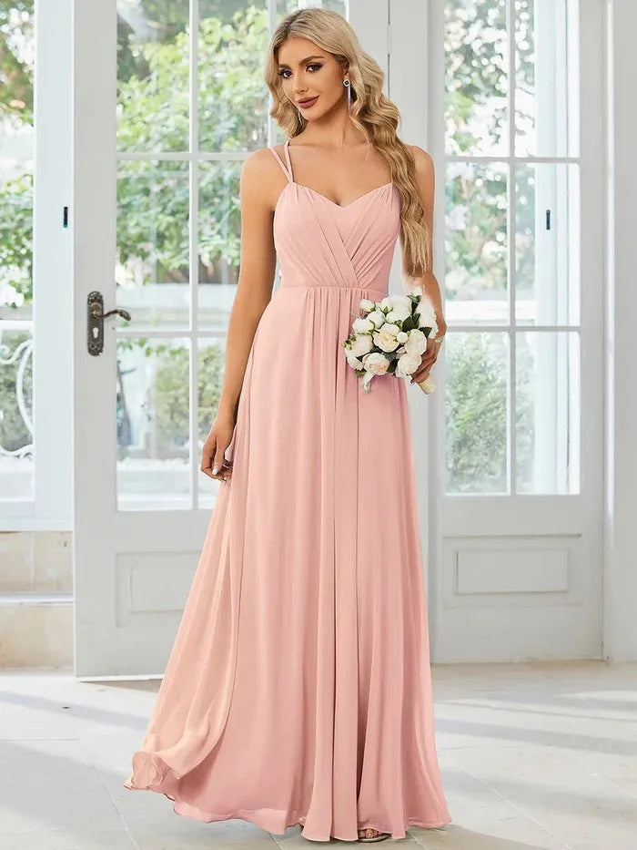 Women's long sling banquet dress with pleating detail in A-line silhouette, available in multiple colours