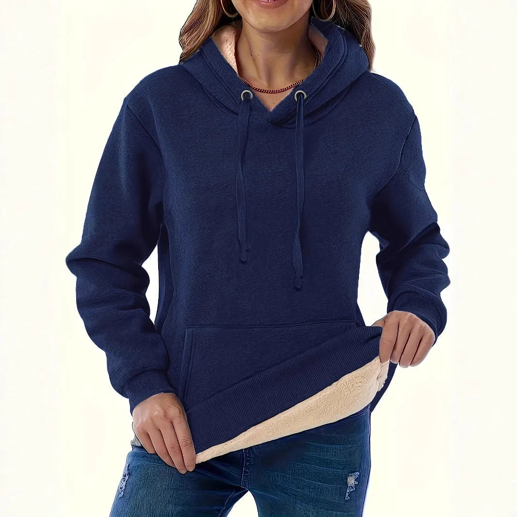 Women's loose black hooded sweater with pockets and a 3D textured pattern, long sleeves.