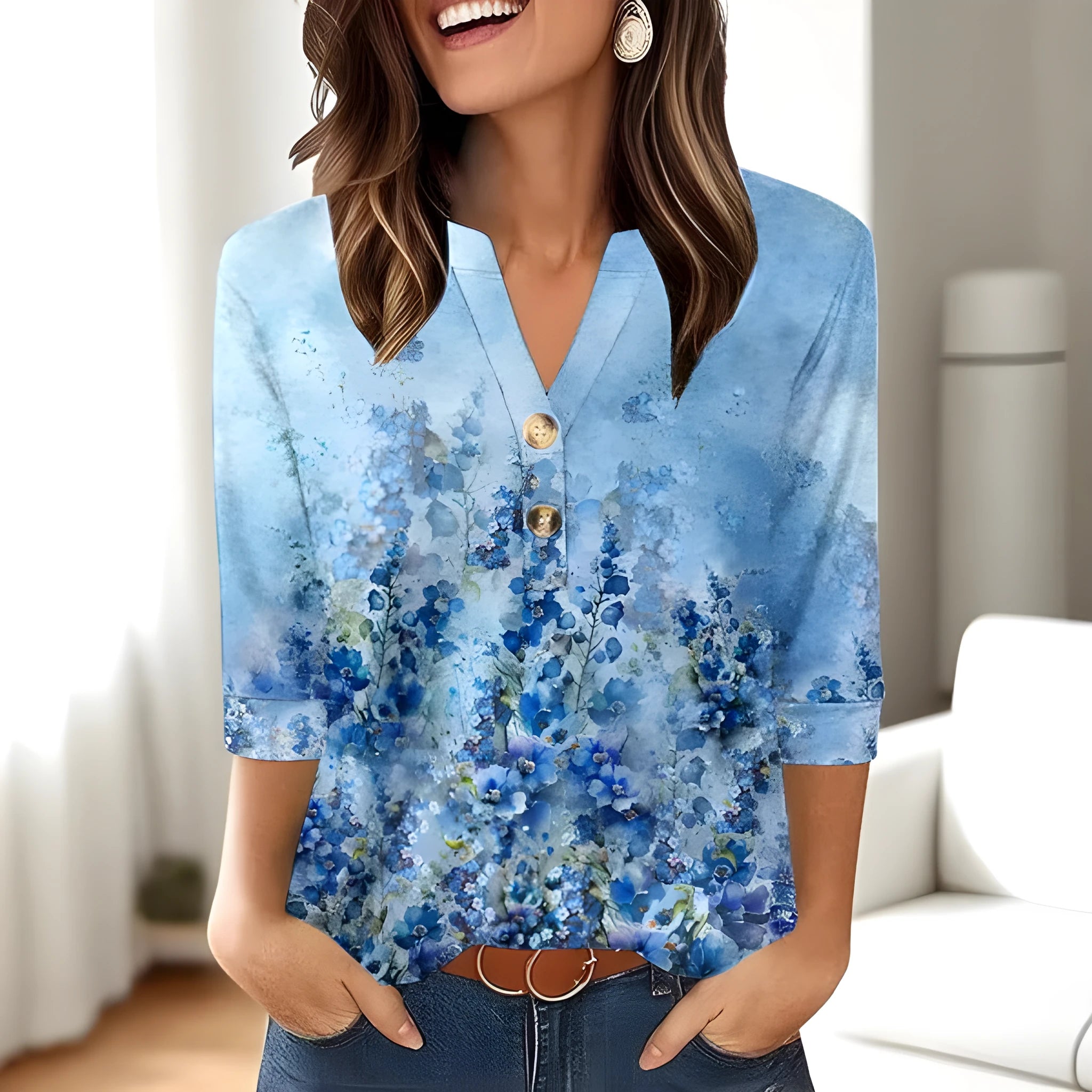 Women's loose fit V-neck top with a colourful 3D effect pattern, shown in a casual setting.