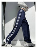 Women's ribbon contrast colour loose straight leg draping trousers in white and navy blue