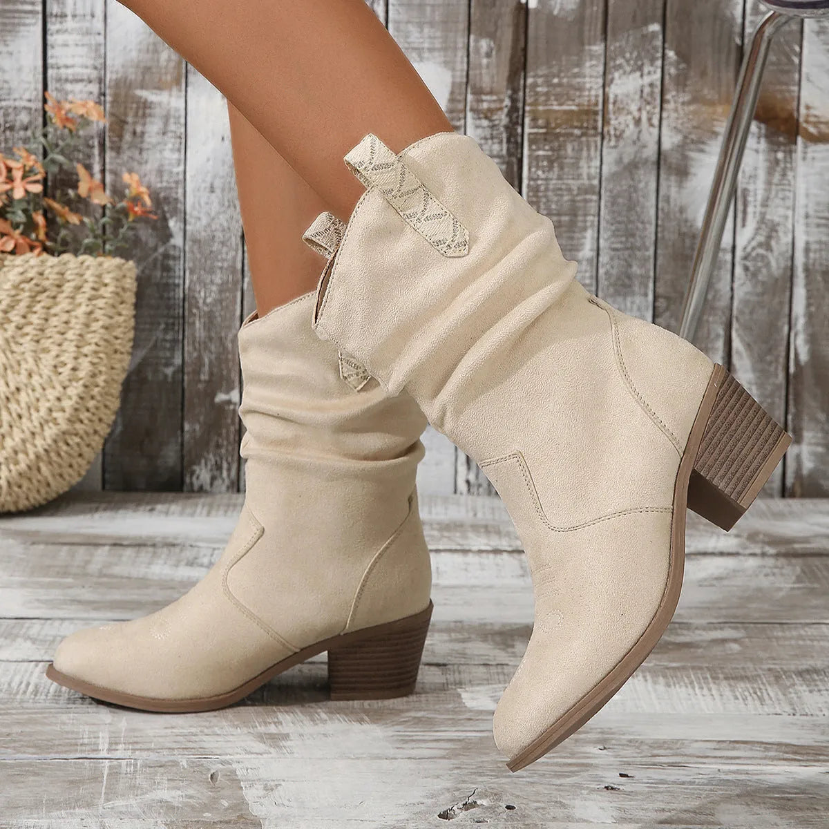 Milky White women's suede mid-calf boots with a pointed toe and mid-heel on a plain background.