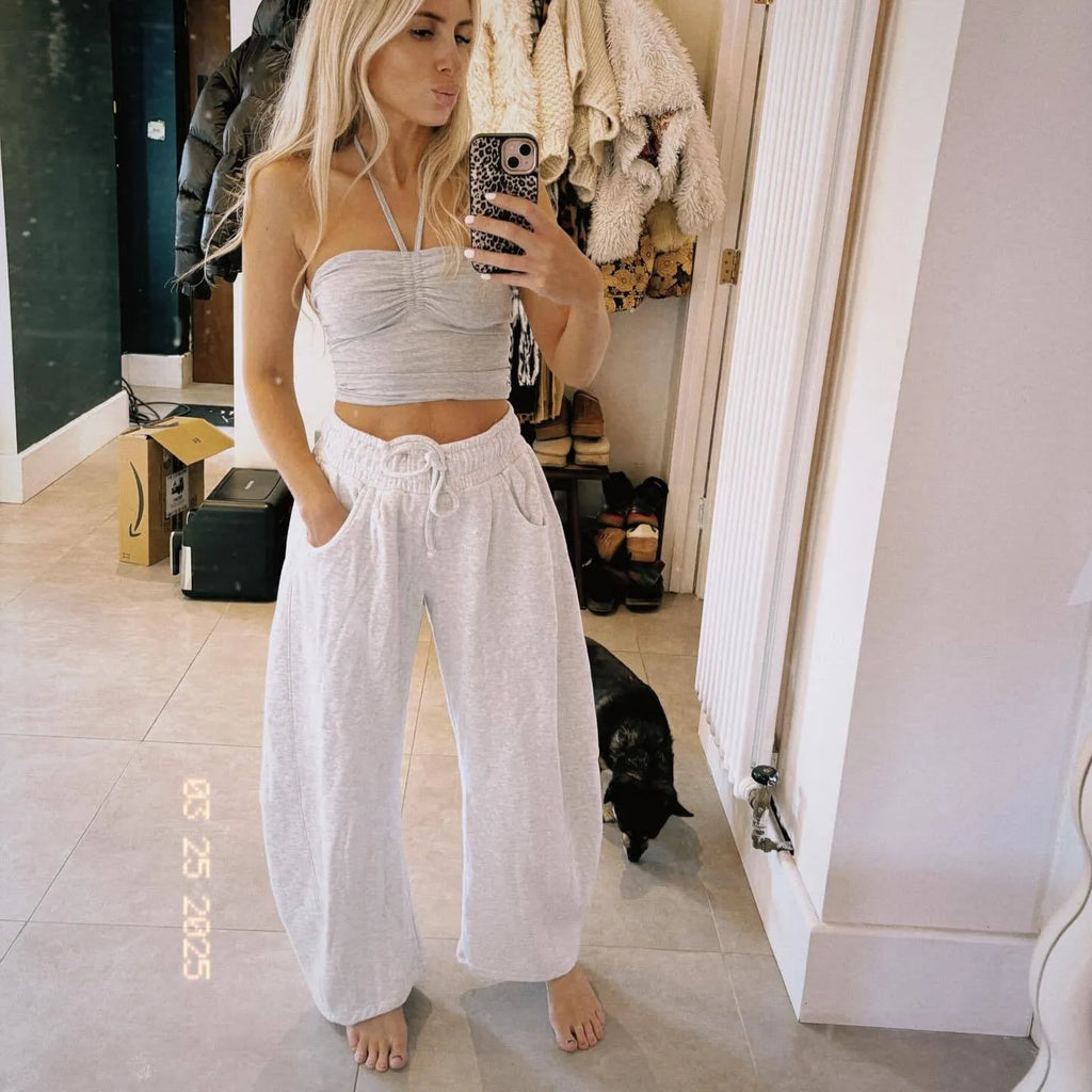 Women's loose cropped sweatpants with drawstring waist and side pockets in street fashion style