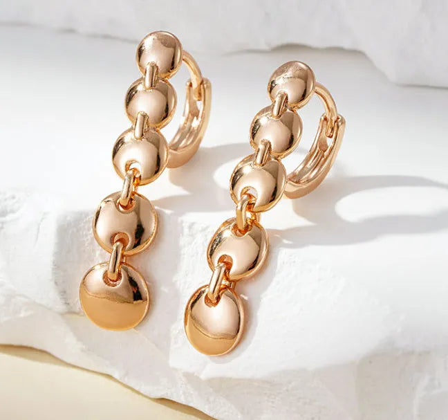 Gold-coloured retro long round circle earrings with woven texture on copper base