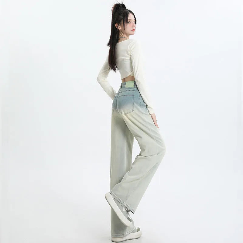 Women's gradient blue straight-leg denim trousers with wide leg design on hanger