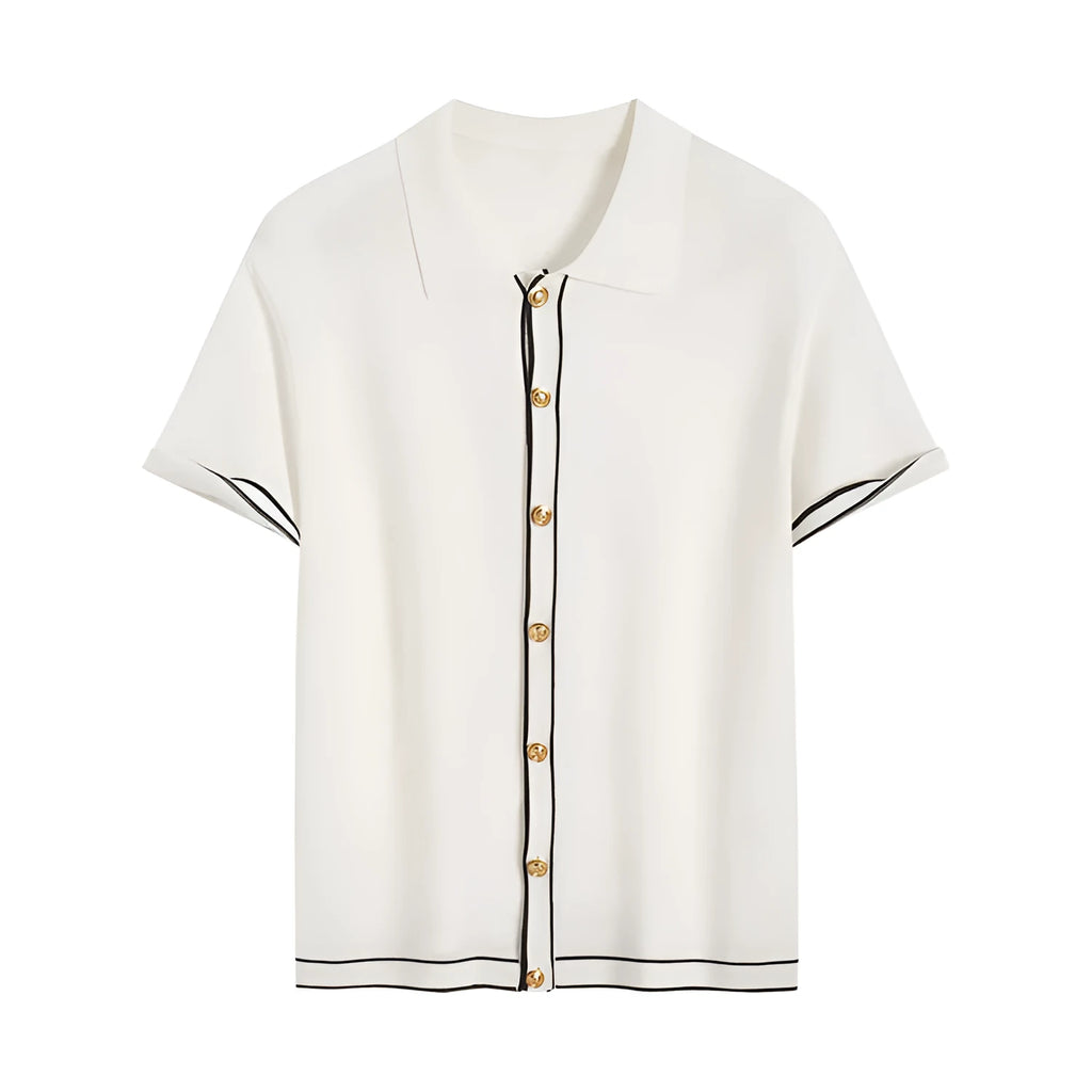 White short sleeve women's cardigan with dark contrast lapels, laid flat.