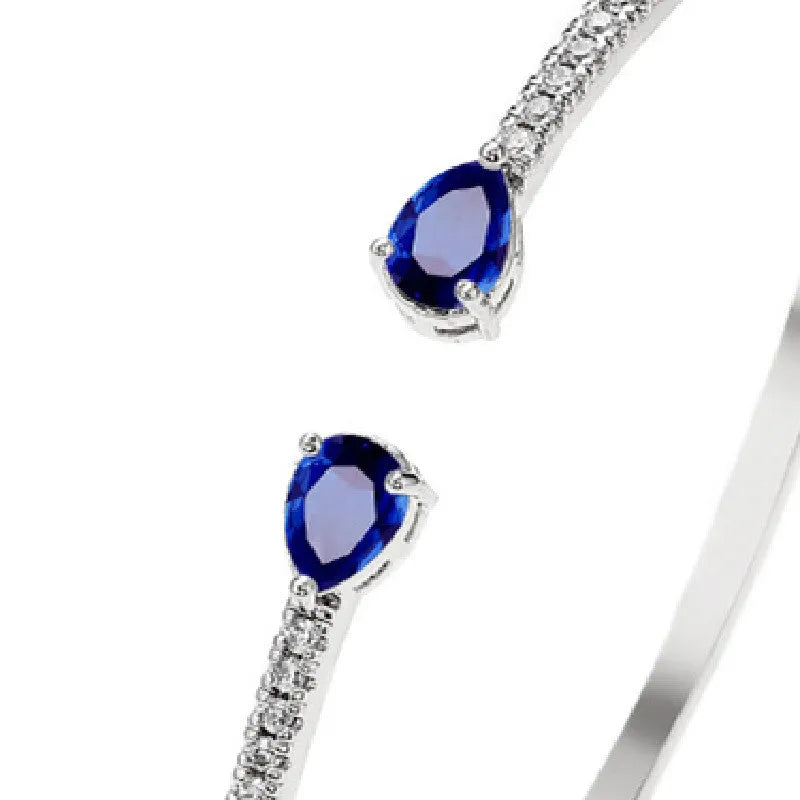 Copper bracelet with multi-zircon decorative inlay in simple style, shown in blue and white colour options