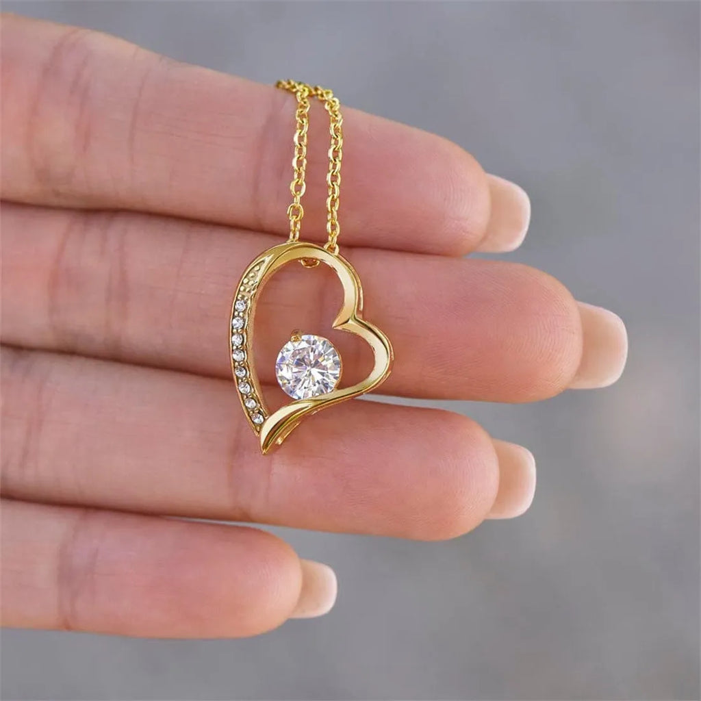 Hollow heart-shaped necklace in silver or gold finish with greeting card and gift box