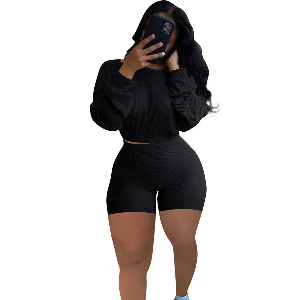 Women's off-the-shoulder long sleeve top with sunken stripe detail and matching solid colour shorts two-piece set.