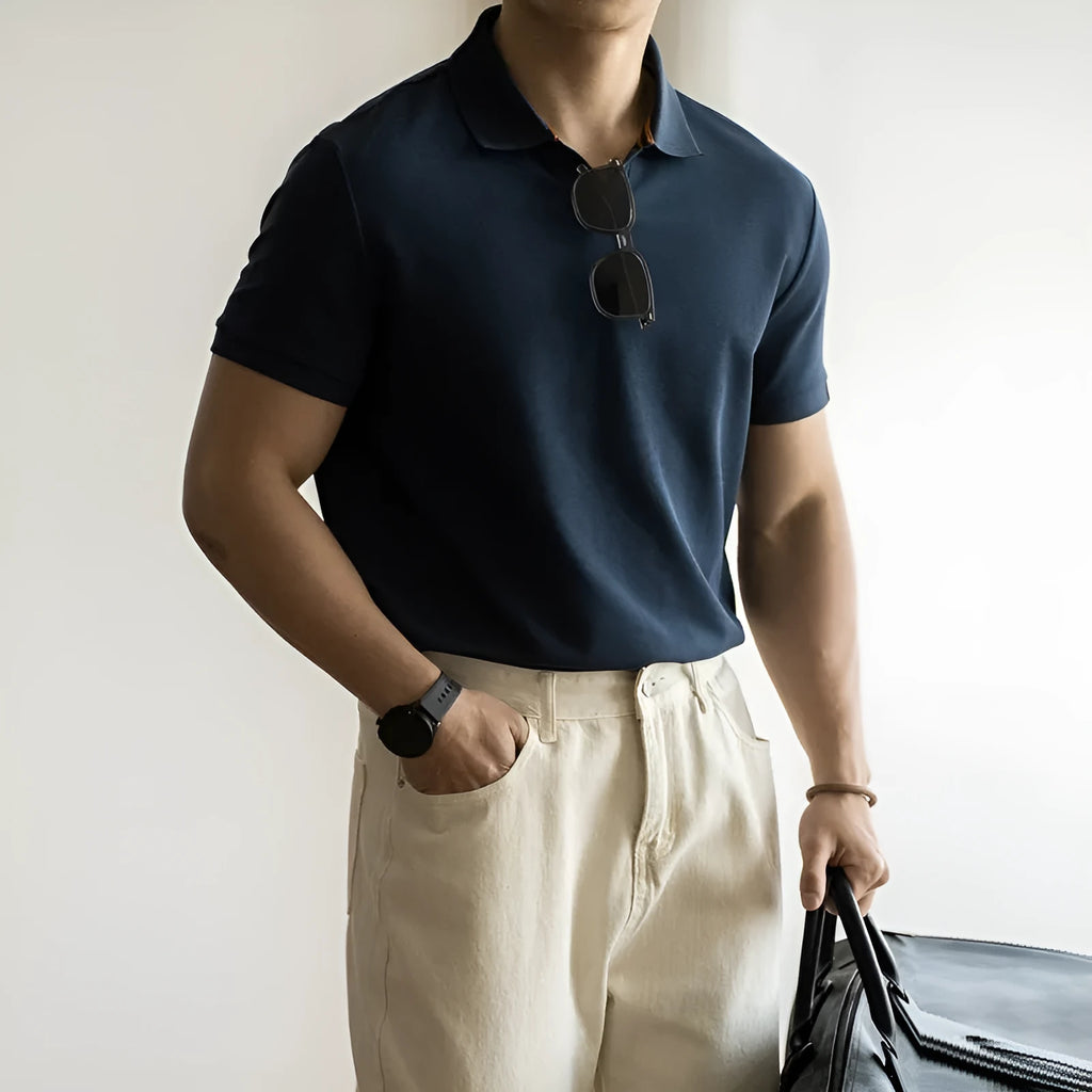American-style short-sleeved polo shirt in a cotton-polyester blend, shown in blue, black, or white.