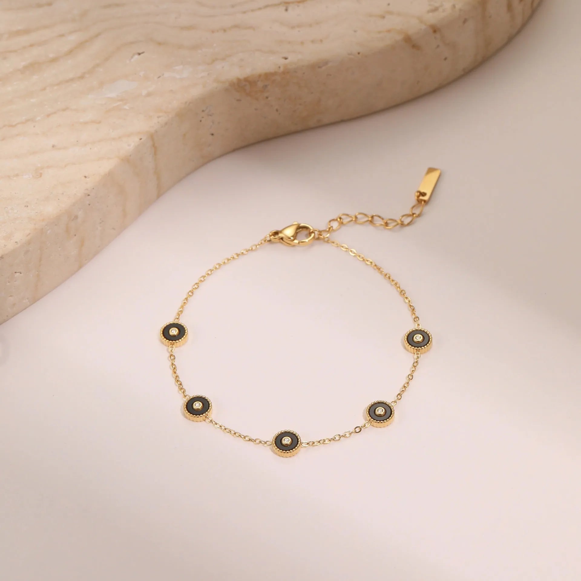 Women's stainless steel bracelet and necklace set with electroplated 18K gold finish in geometric design