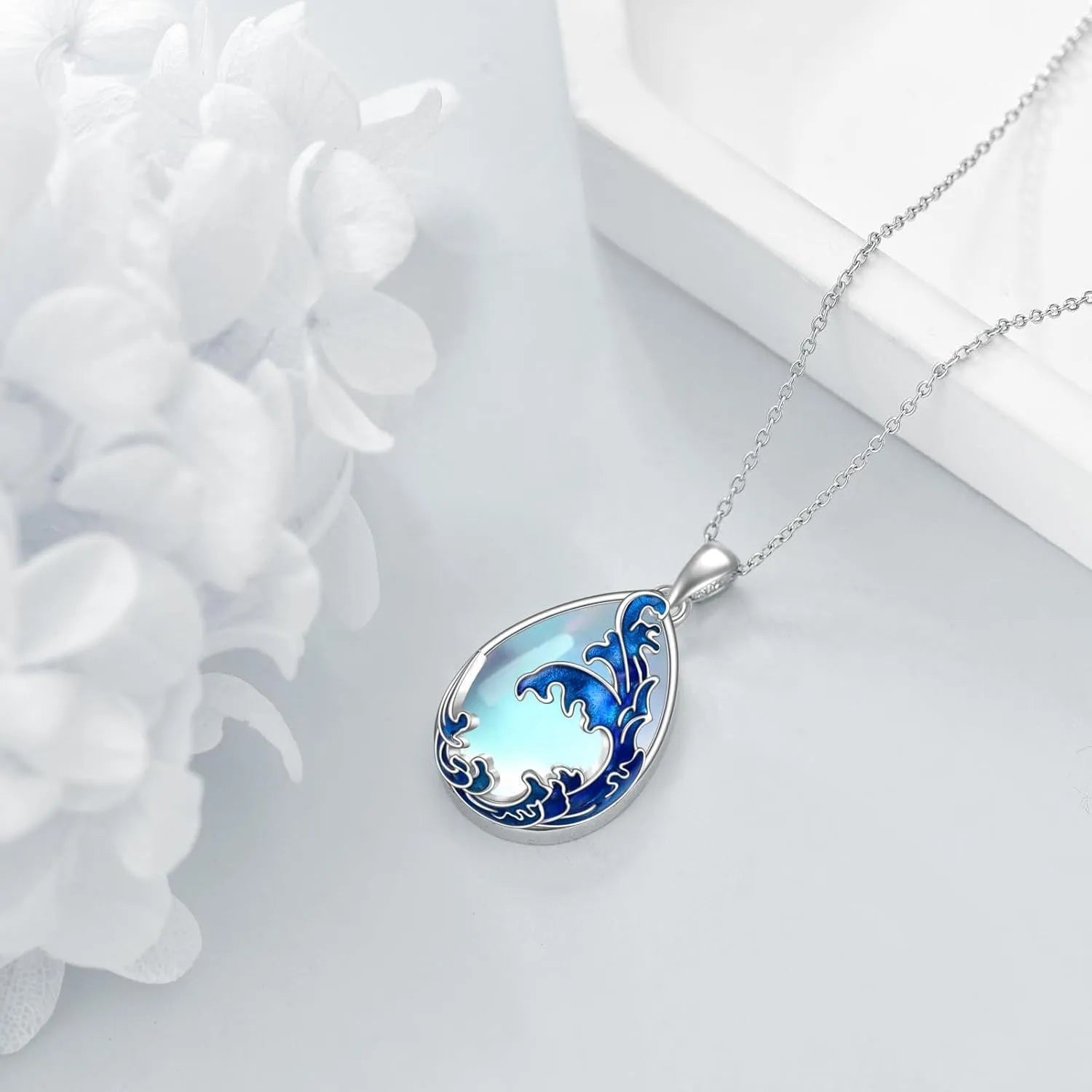 Moonstone blue heart pendant necklace with adjustable chain on display