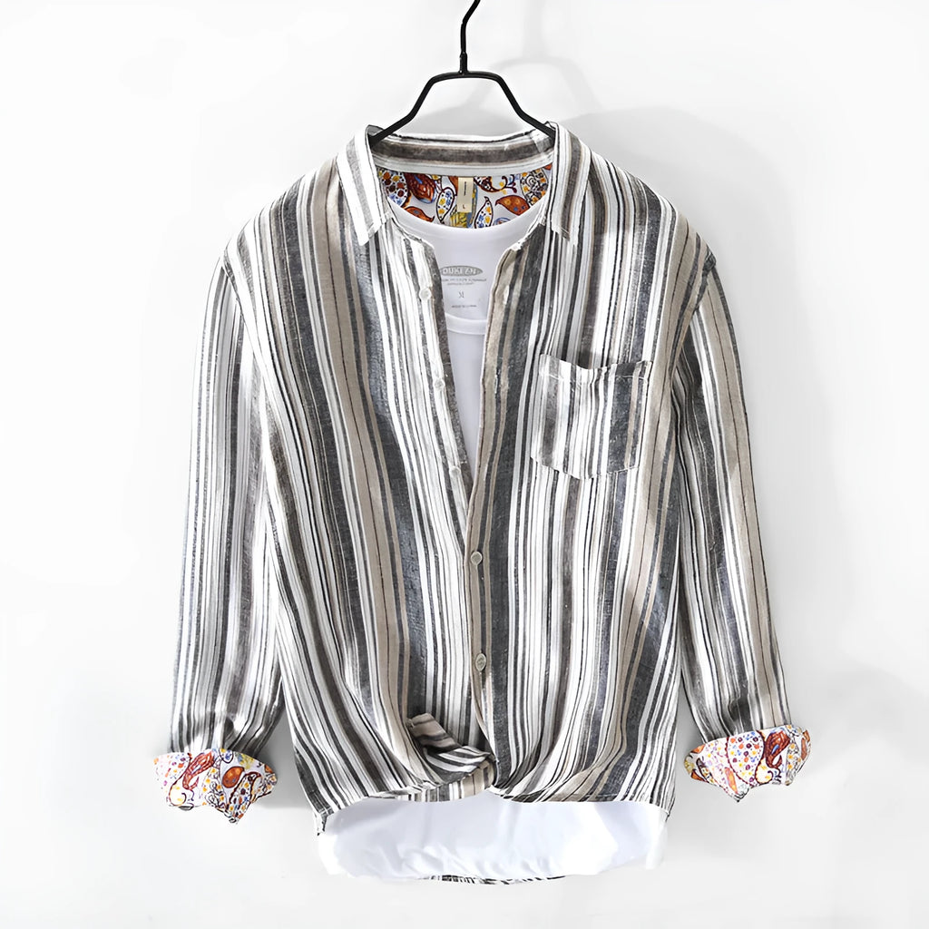 Grey striped linen shirt with long sleeves on male model showing loose casual fit