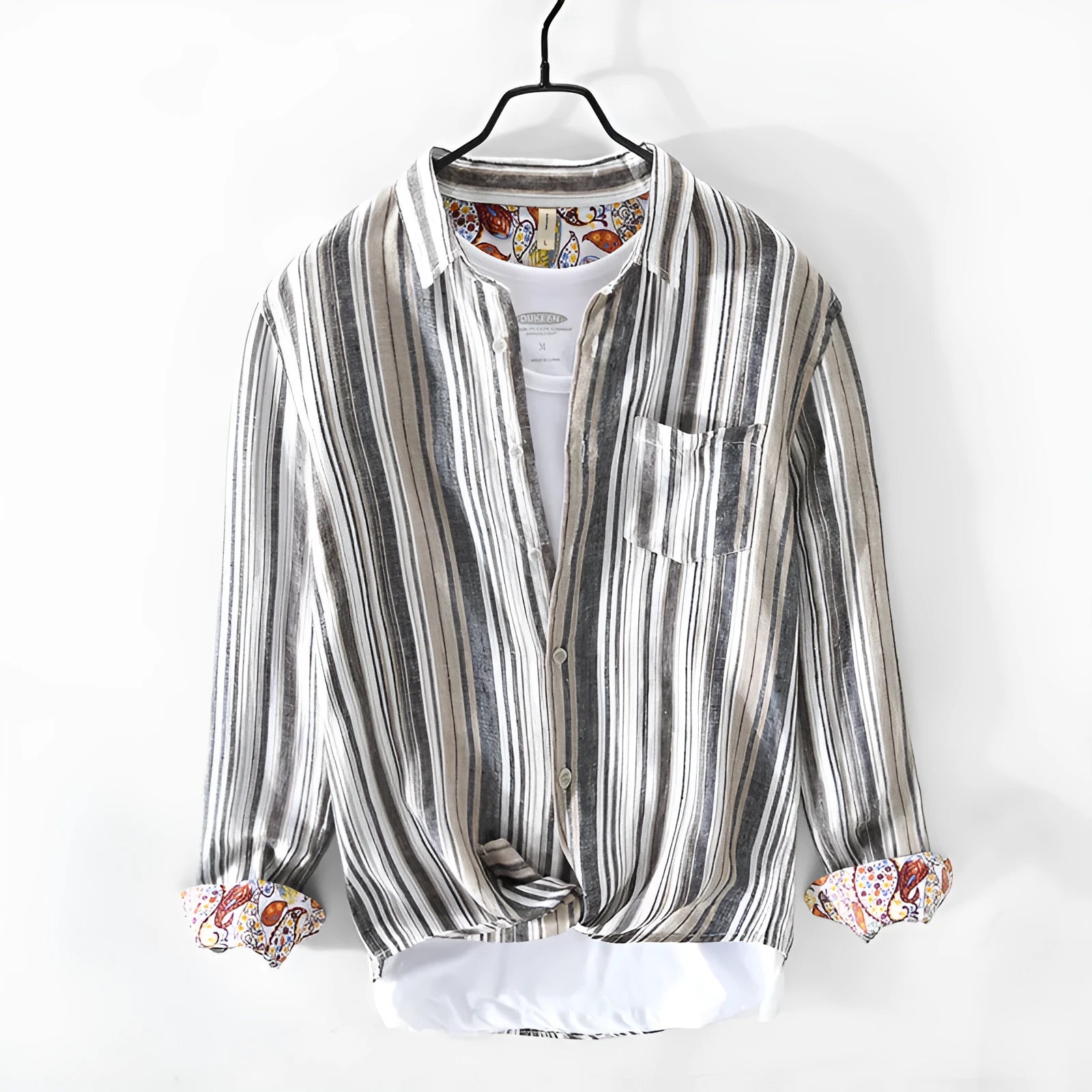 Grey striped linen shirt with long sleeves on male model showing loose casual fit