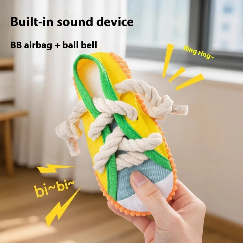 Yellow plastic dog chew toy with sound effects for molar relief and interactive play.