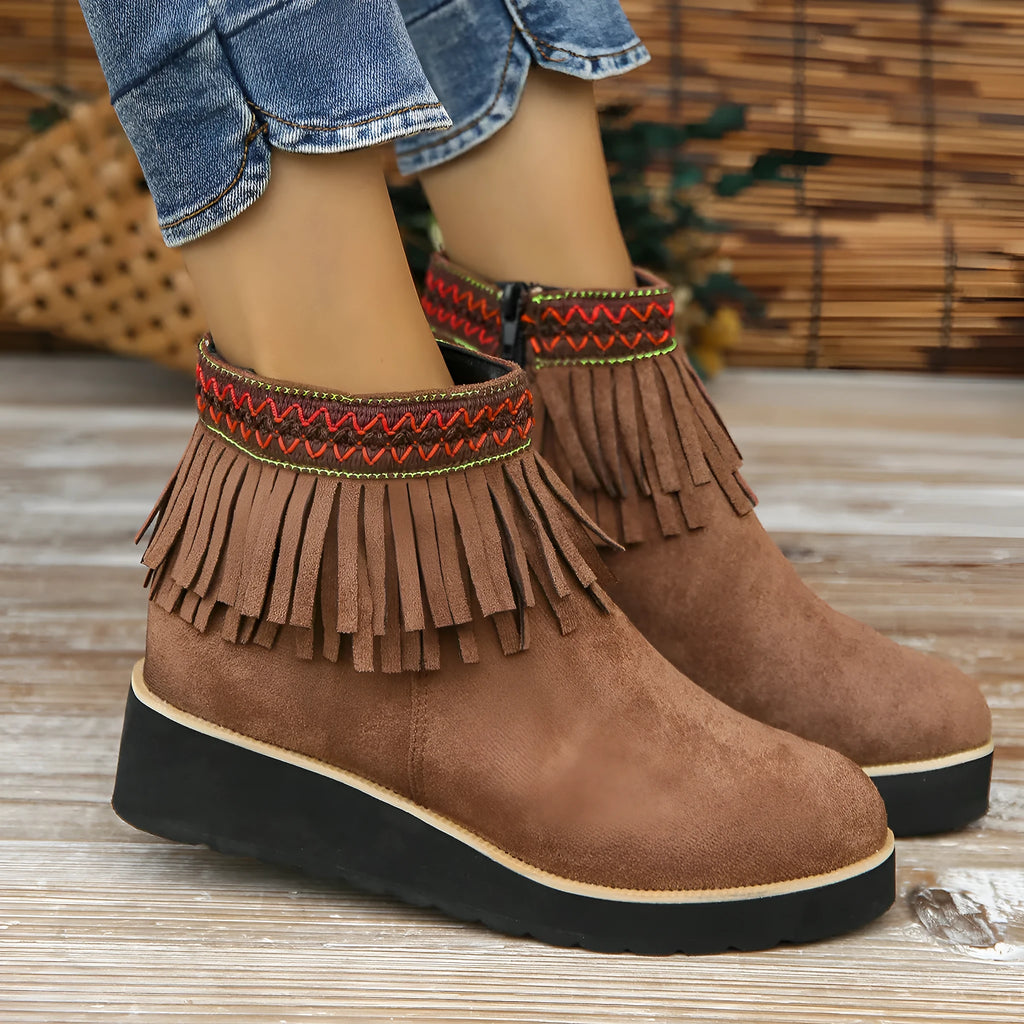 Dark brown suede women's wedge ankle boots with side zip and tassel on a waterproof platform sole.