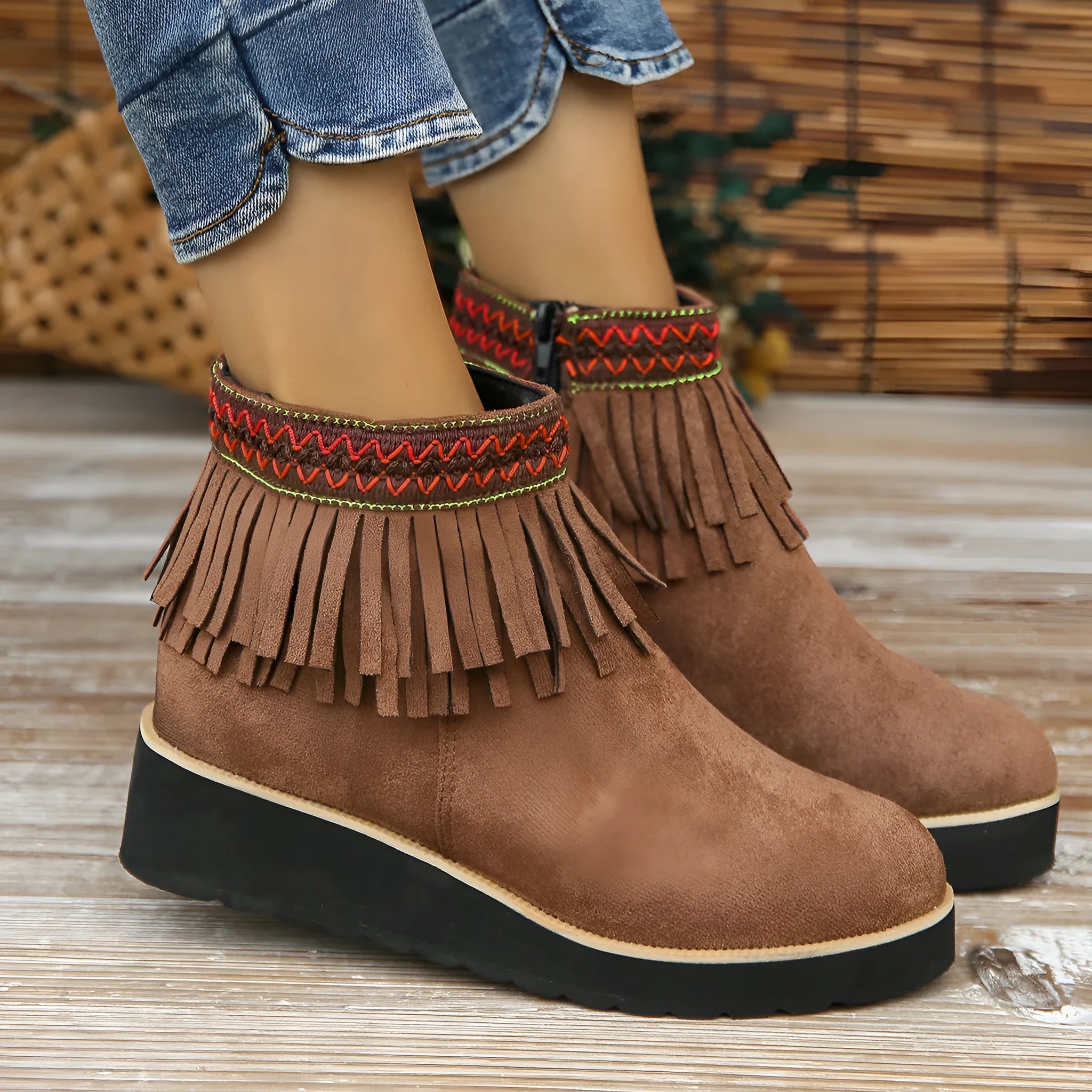Dark brown suede women's wedge ankle boots with side zip and tassel on a waterproof platform sole.
