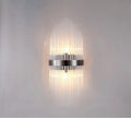 Modern wall lamp with crystal petal shade in titanium gold or black metal finish