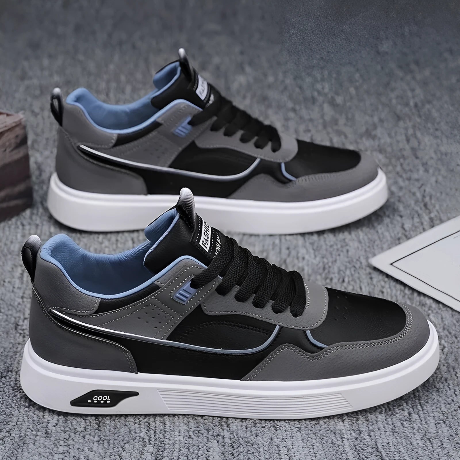 Men's low-top canvas board shoes in black, beige, and grey with mesh lining and leather stitching