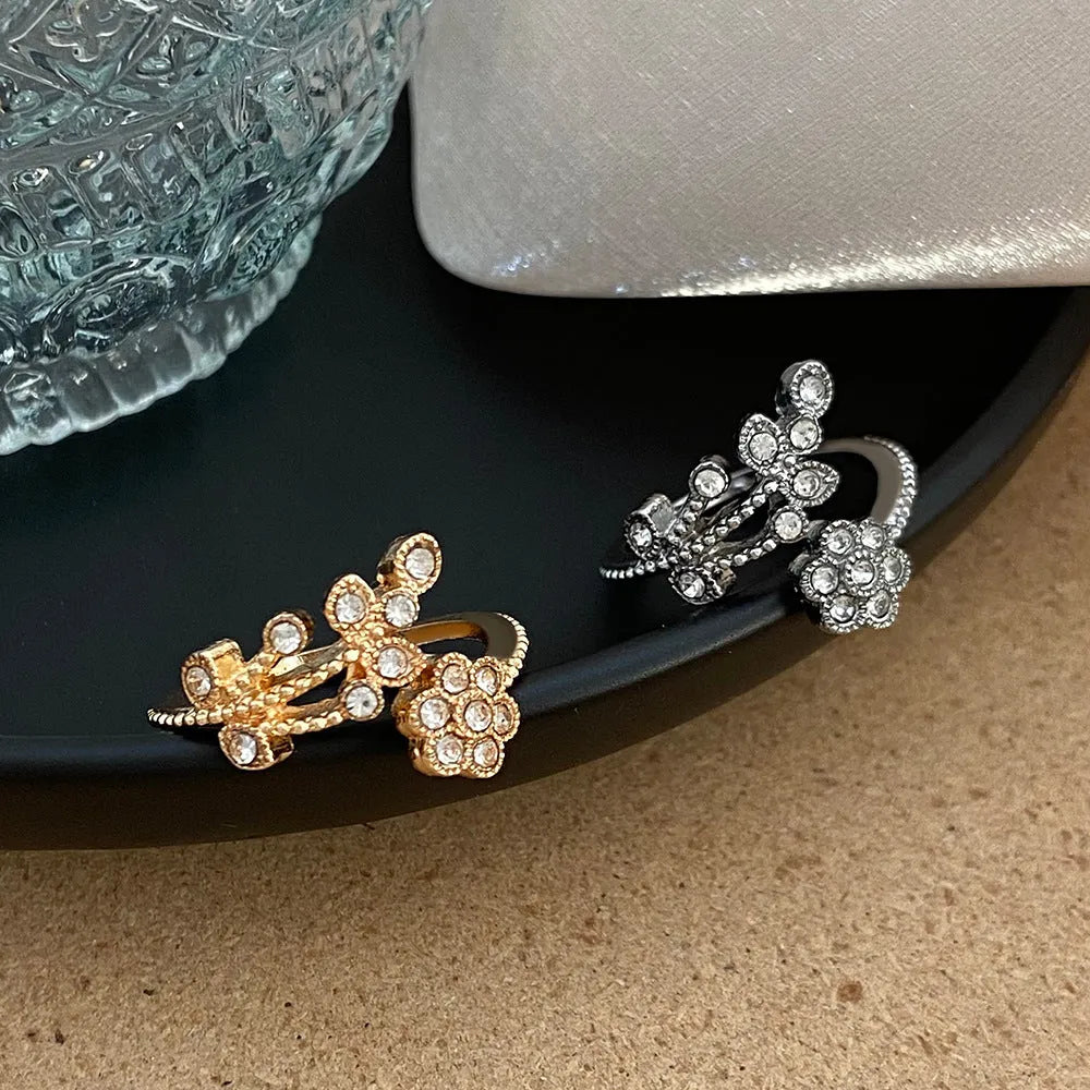 Open-mouth copper ring with diamond-cut flower and leaf design for women in gold or white finish