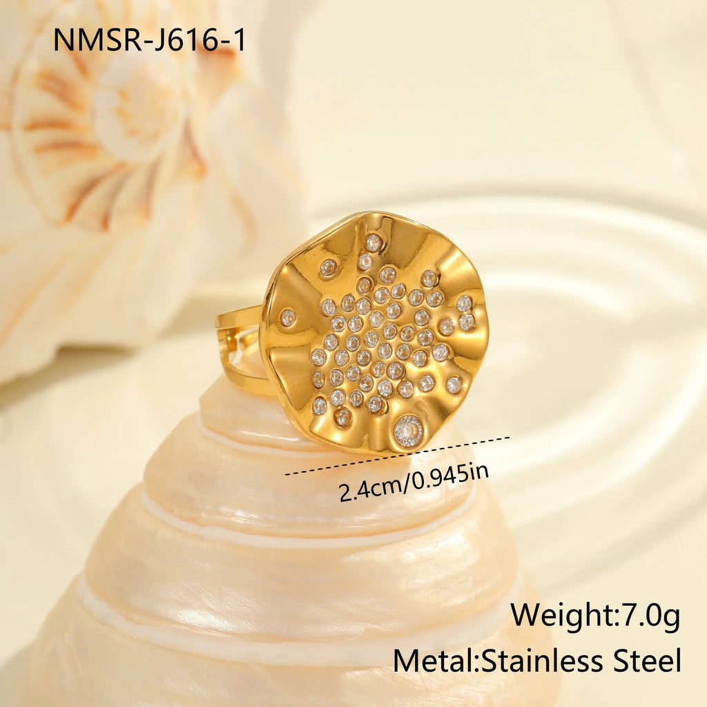 Adjustable open-mouth stainless steel ring with pleated geometric pattern and inlaid coloured crystal accents.