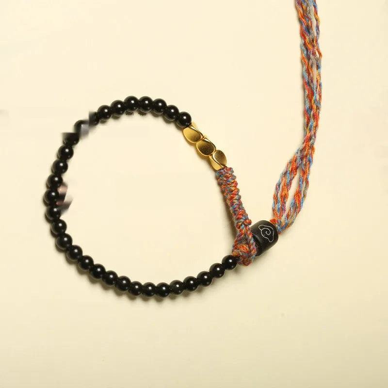 Hand-woven obsidian carrying strap showing woven texture and adjustable 15.5-16cm length