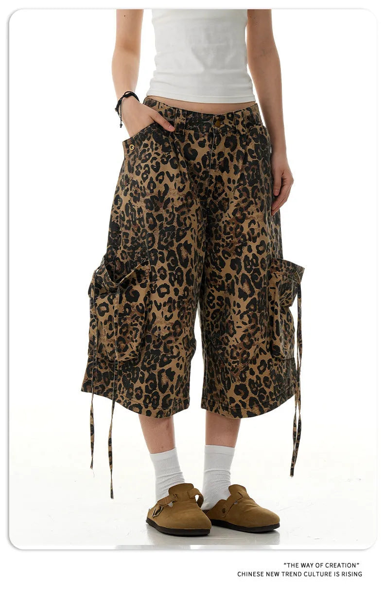 Leopard print women's trousers with high waist, button fly, and cropped straight-leg design