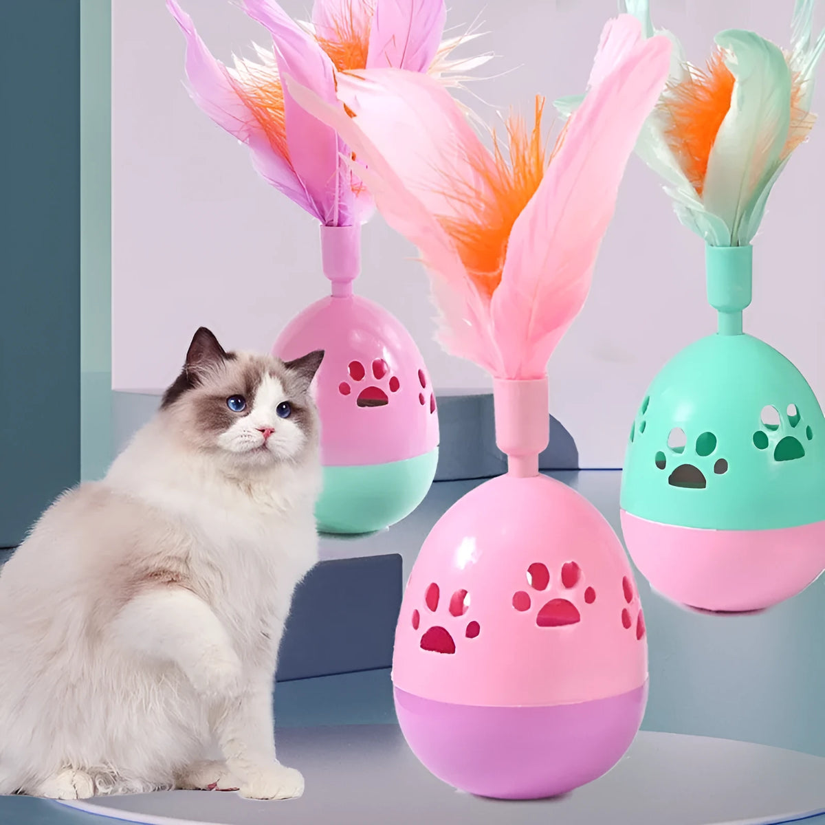 Tumbler bell cat toy in pink purple green, 15cm ABS plastic body with feathers and 6.5cm base