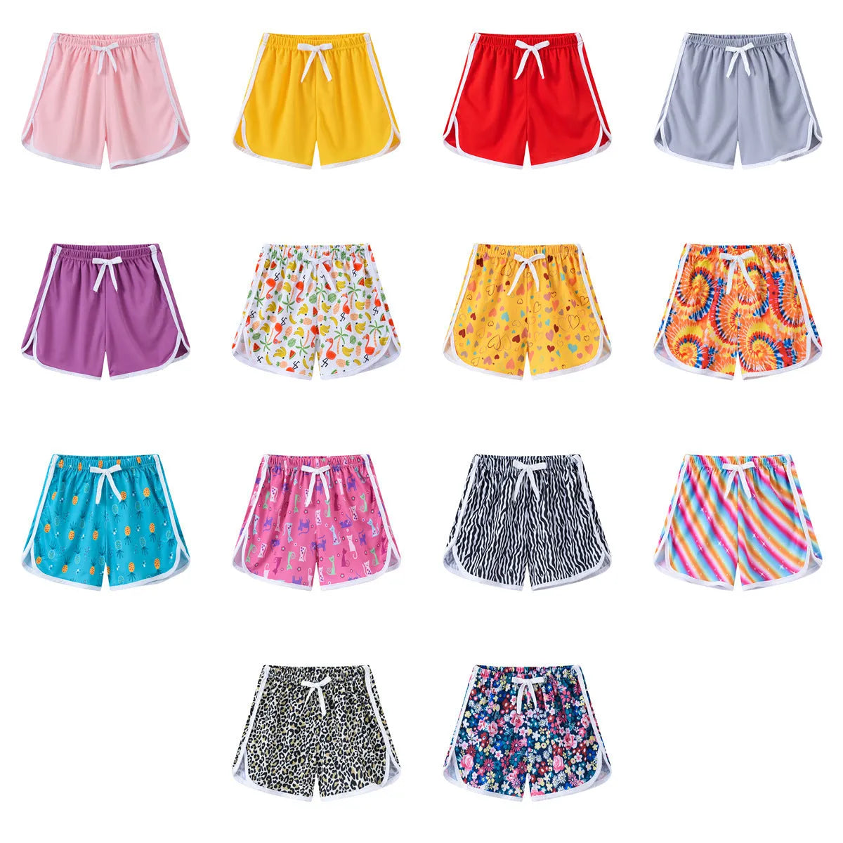 Children's solid-colour beach shorts in various prints including leopard, stripes, and floral patterns.