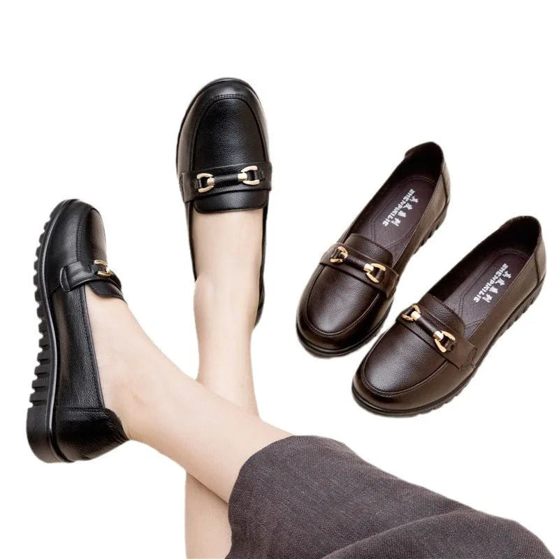 Black women's slip-on pumps with a round toe, low flat heel, and soft rubber sole.