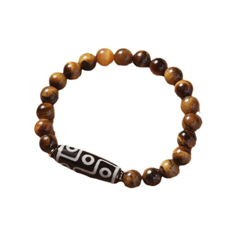 Simple Tigereye Dzi bead Buddha bracelet with single bead design on wrist