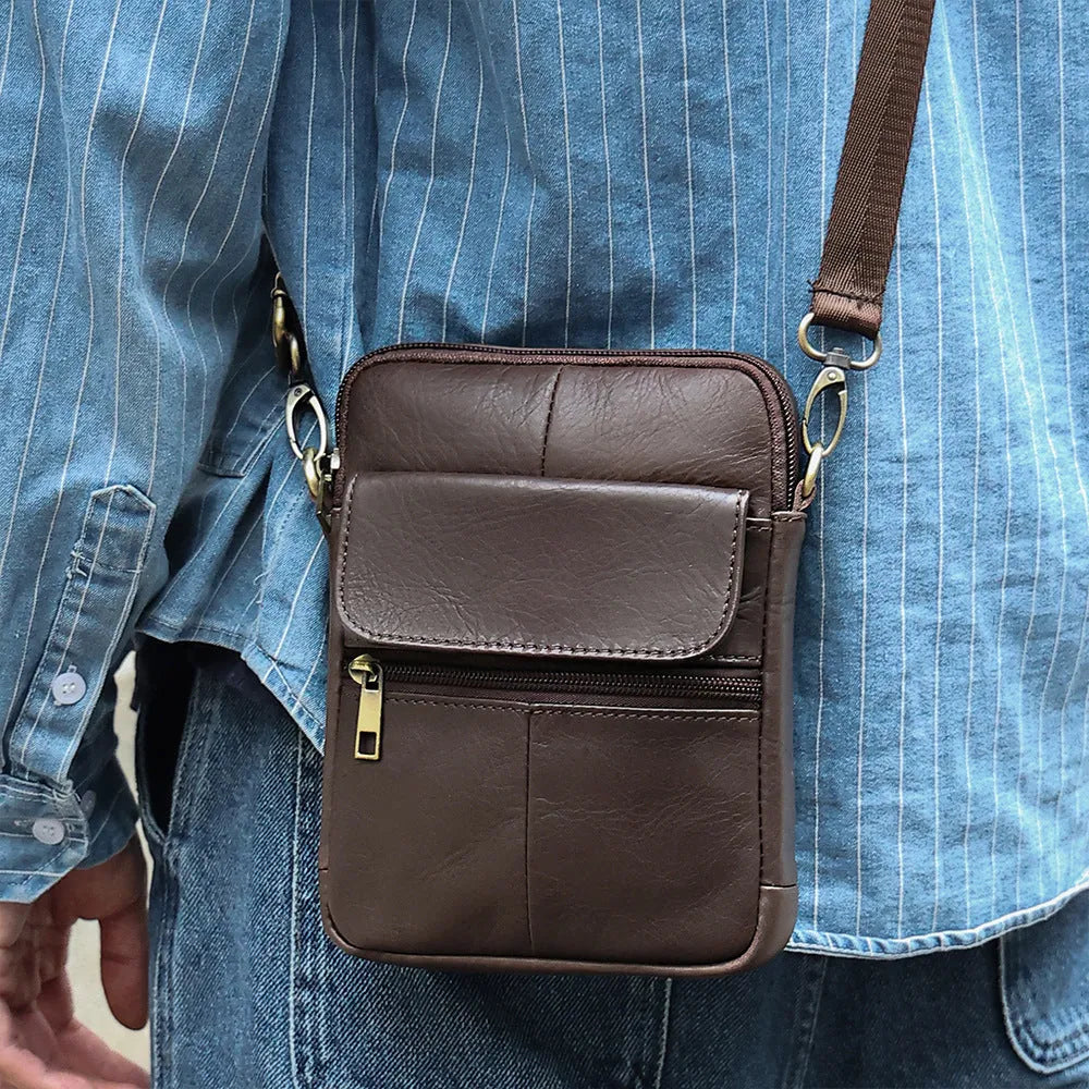 Men's brown leather crossbody shoulder bag showing sewing line details and strap