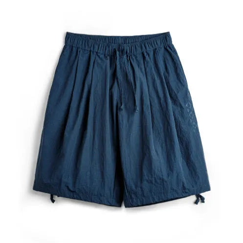 Men's loose fit embroidered beach shorts in Prussian Blue nylon fabric