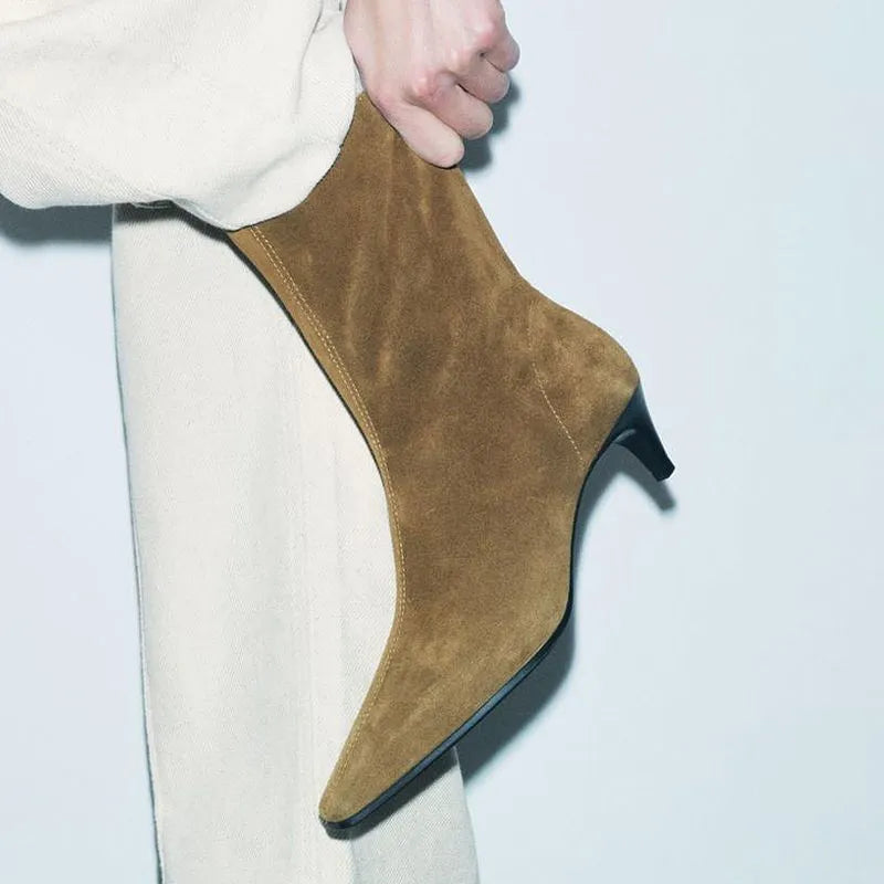 Brown women's square toe ankle boots with side zip and stiletto heel on a waterproof platform sole